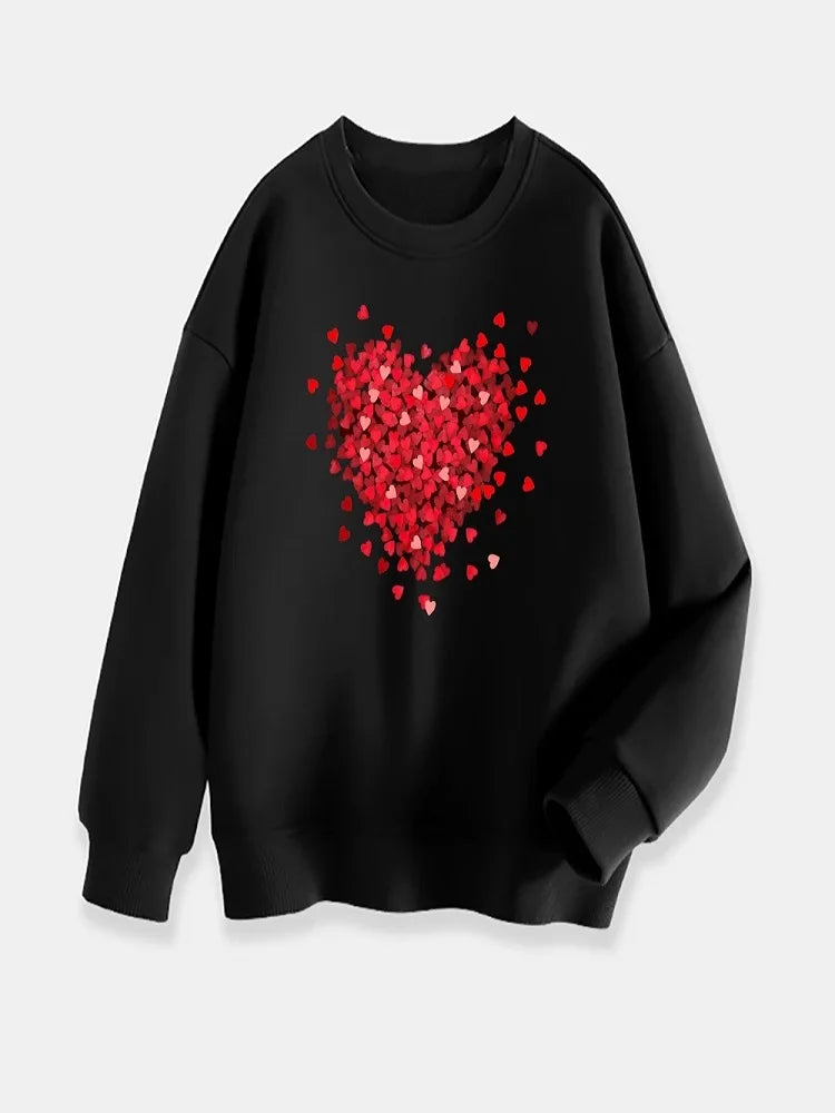 Black sweatshirt with a red heart design on a light gray background
