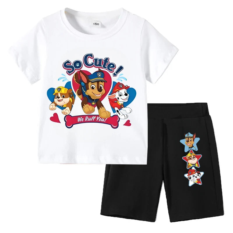 Children's outfit with white t-shirt and black shorts featuring cartoon characters and text on a white background.