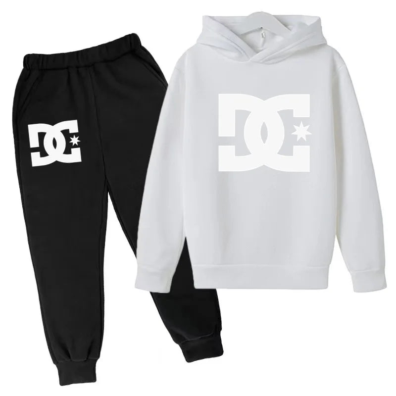 Black jogger pants and white hoodie with DC logo on a white background