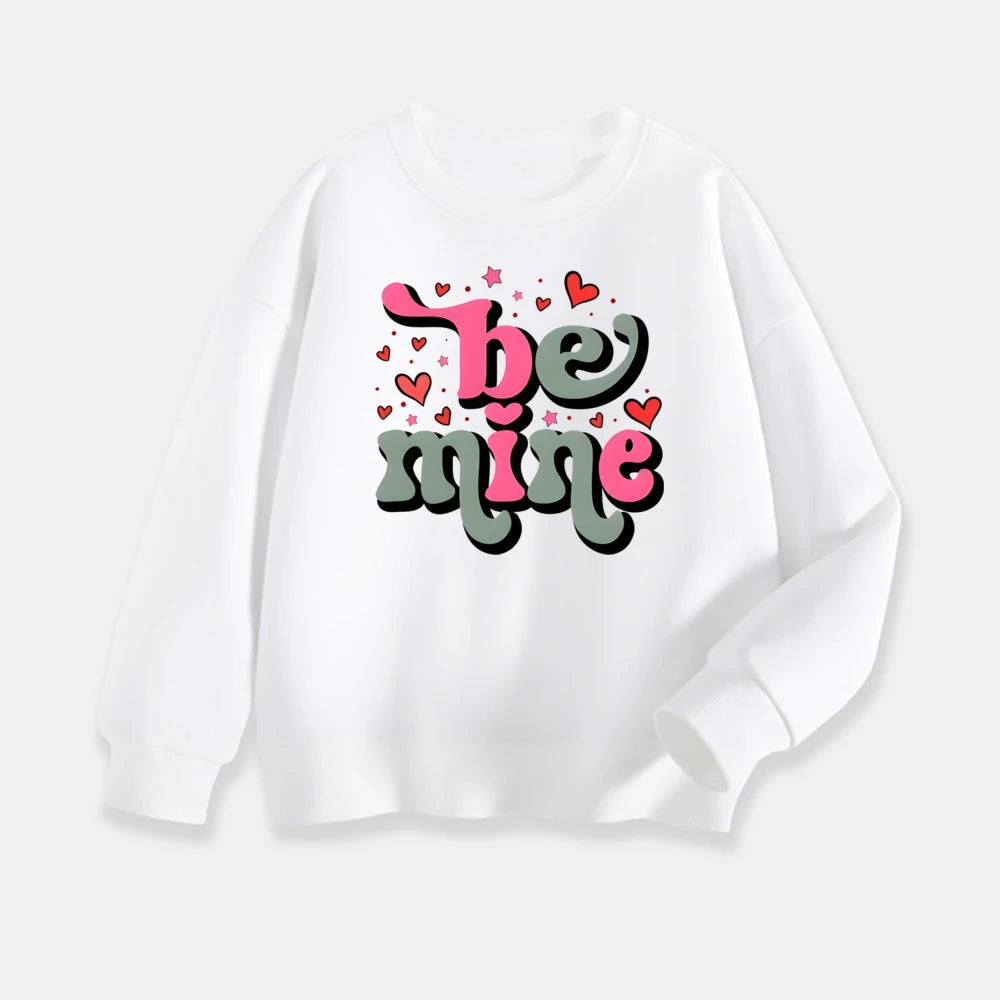 White sweatshirt with 'be mine' text and hearts on a white background