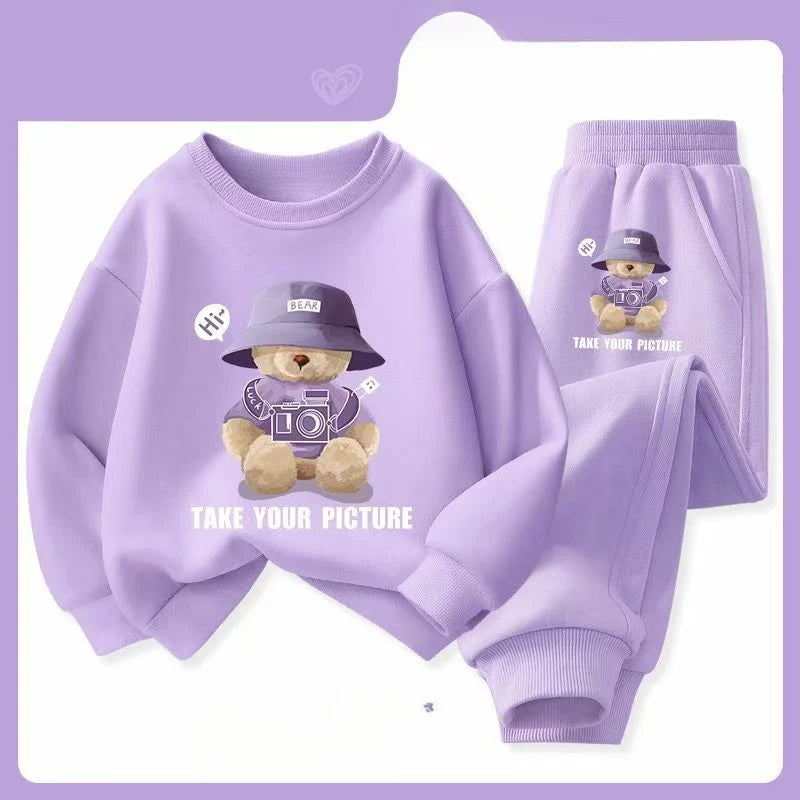 Purple children's sweatshirt and pants set with teddy bear design on a purple background