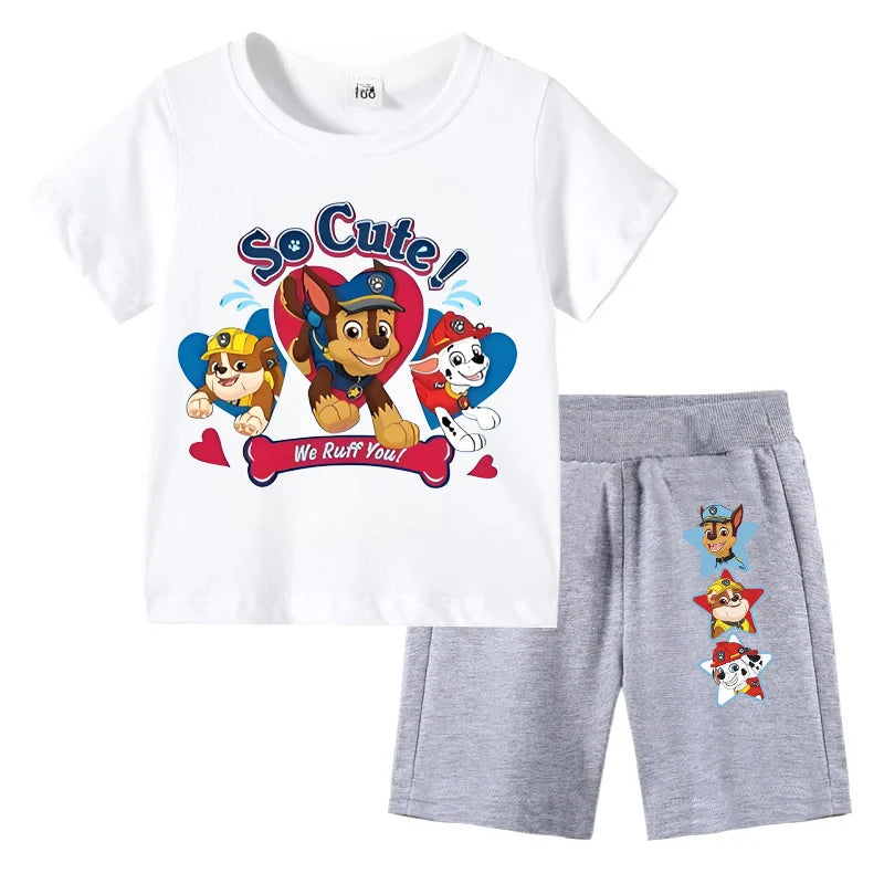 Children's outfit with white t-shirt and gray shorts featuring cartoon characters and text on a white background.