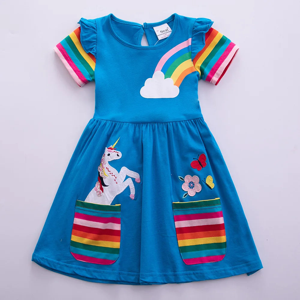 Blue dress with unicorn and rainbow design on a light gray background