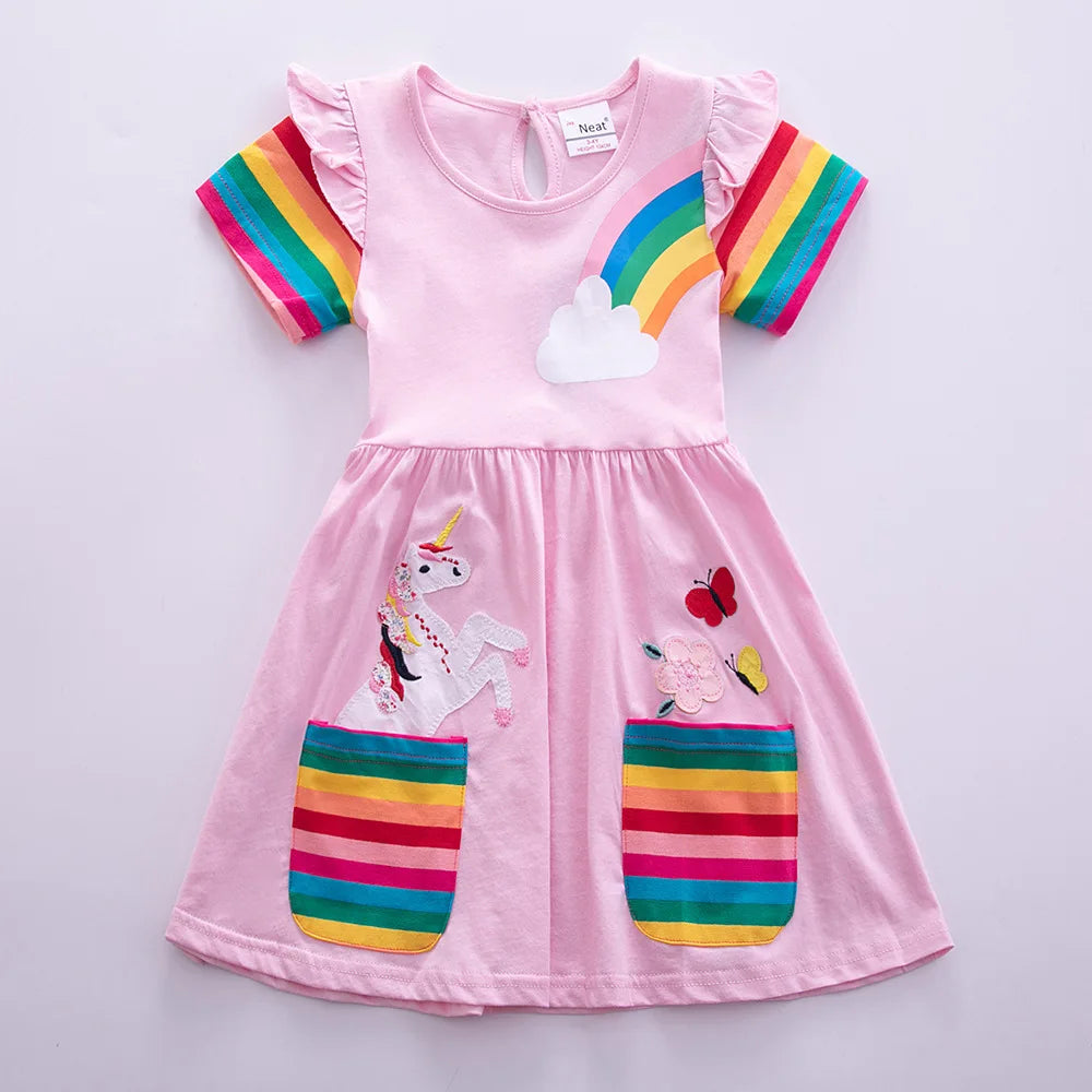 Pink children's dress with rainbow and unicorn designs on a light gray background