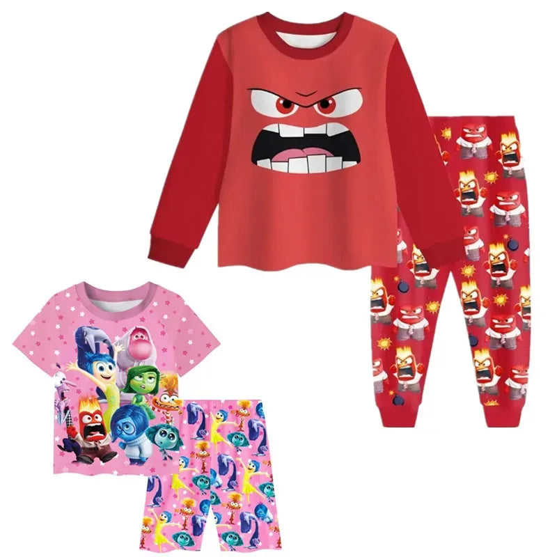 Children's pajama set with red top and pink pants featuring cartoon characters on a white background.