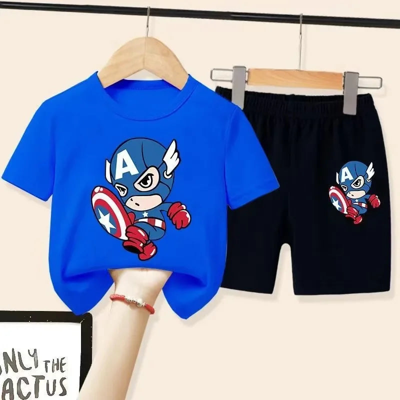 Children's blue t-shirt and black shorts with Captain America design on hangers.