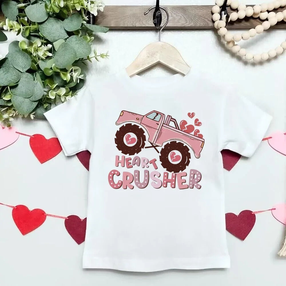 White t-shirt with pink monster truck graphic and 'Heart Crusher' text on a white background with heart decorations.