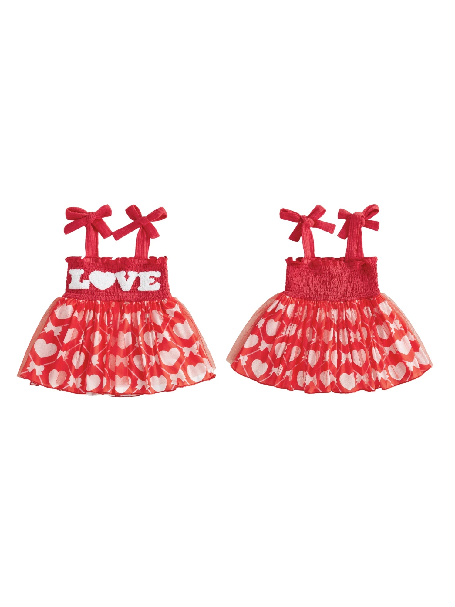 Two red and white children's dresses with heart patterns on a white background