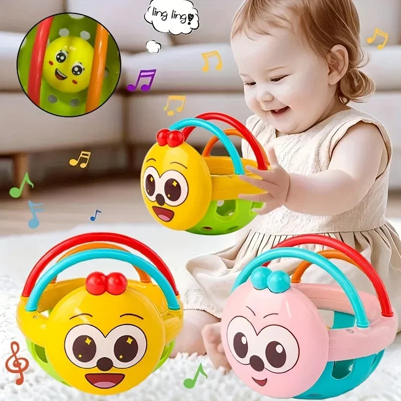 Child playing with colorful baby toys featuring cartoon faces on a light background.