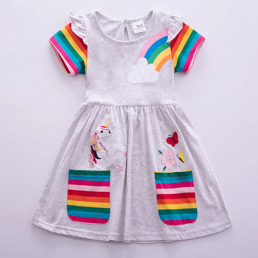 Children's dress with rainbow and unicorn design on a light gray background
