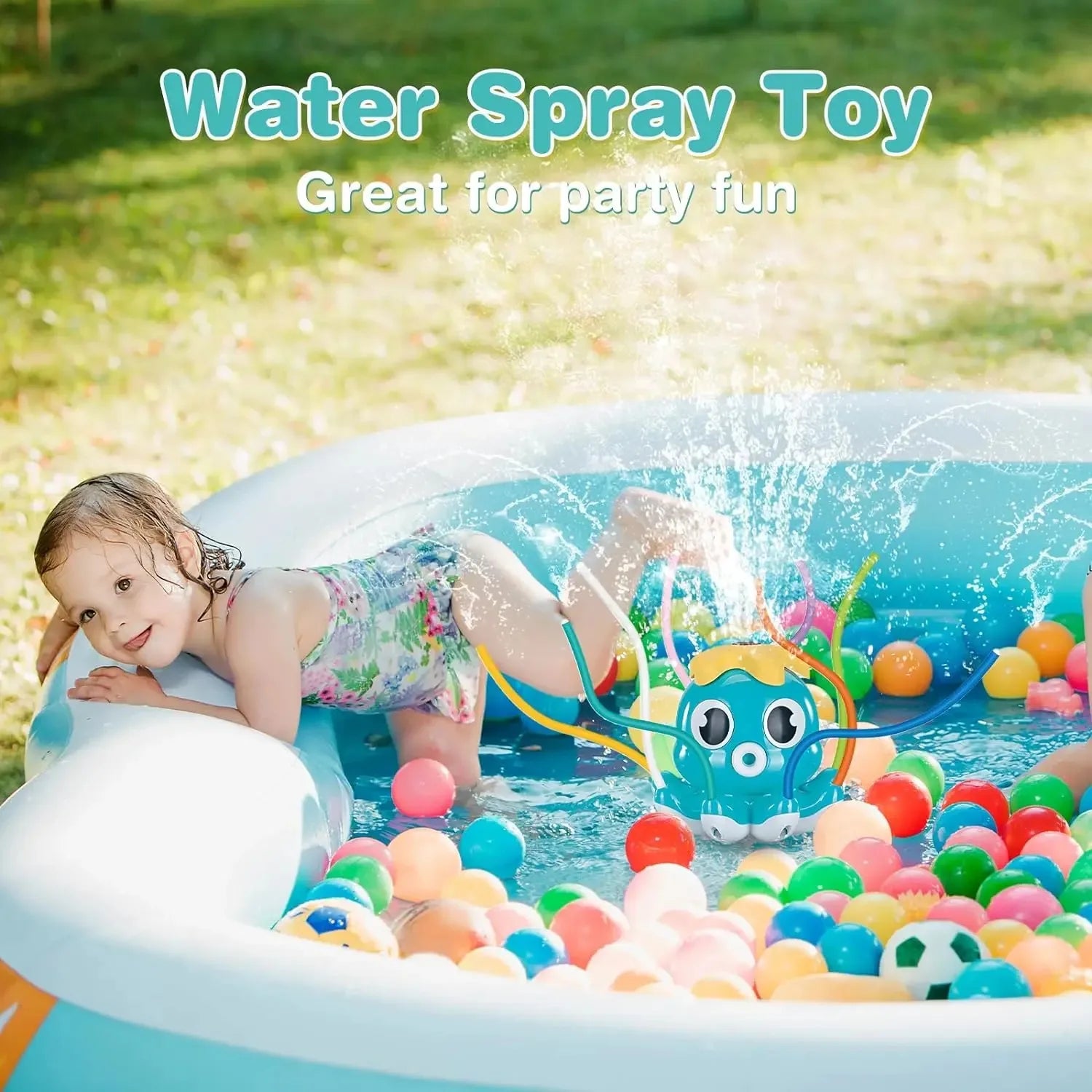 Child playing with a water spray toy in an inflatable pool filled with colorful balls outdoors.