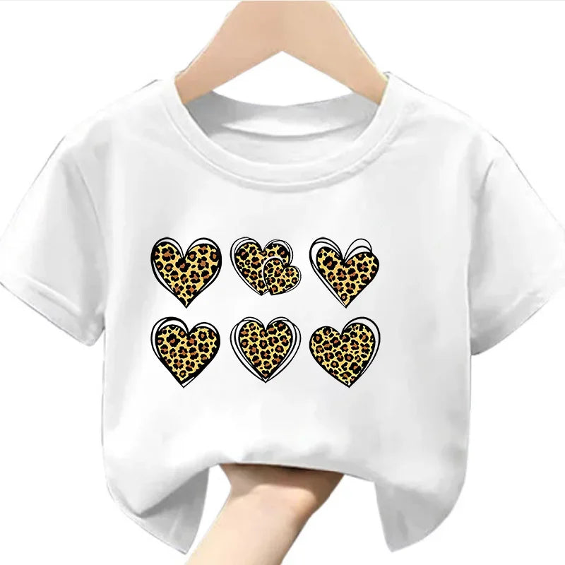 White t-shirt with leopard print heart designs on a hanger