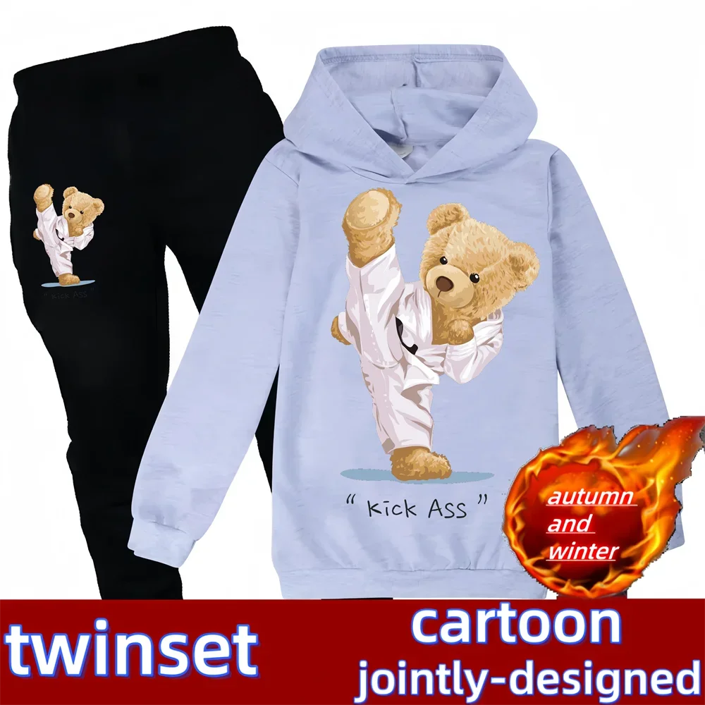 Light blue hoodie with bear graphic and black pants featuring a bear, with 'twinset' branding.