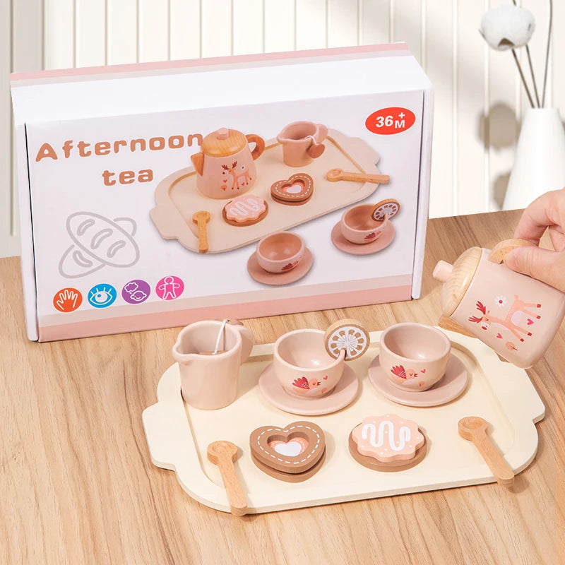 Children's toy tea set with a matching box on a wooden surface